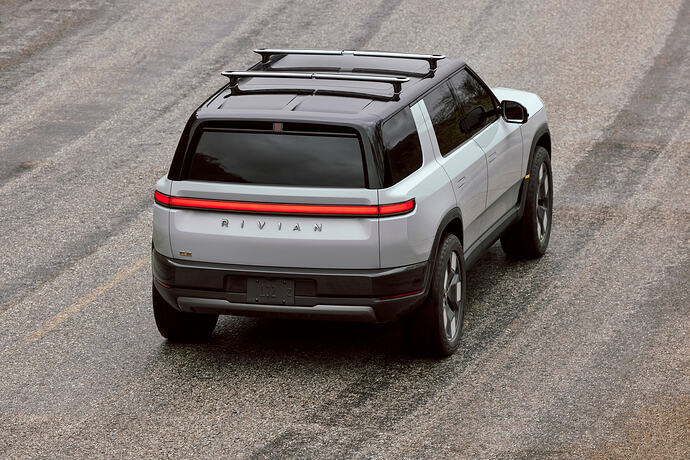 Elevated rear view of a white Rivian R2